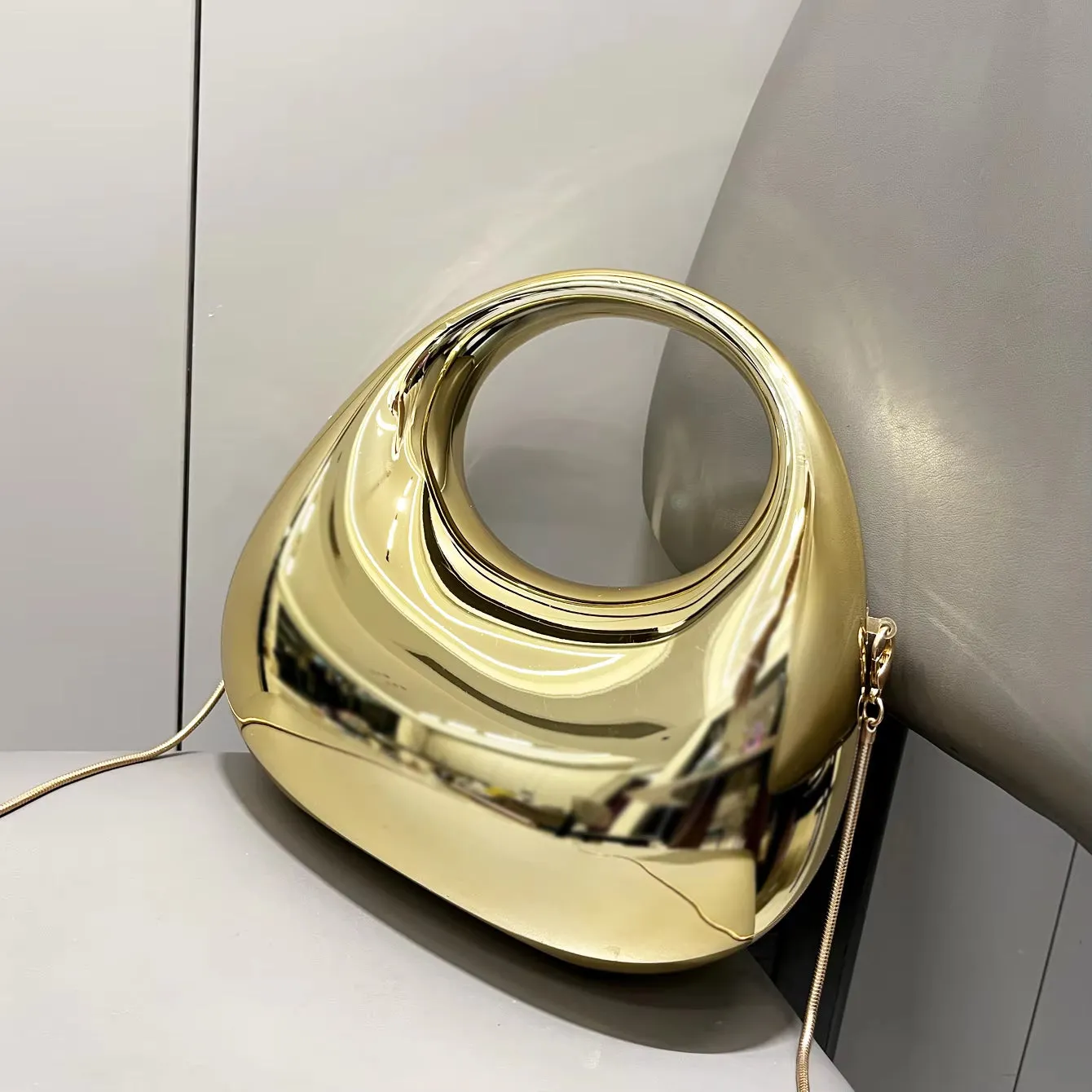 Golden Luxe Moon Clutch – The Epitome of Elegance & Sophistication