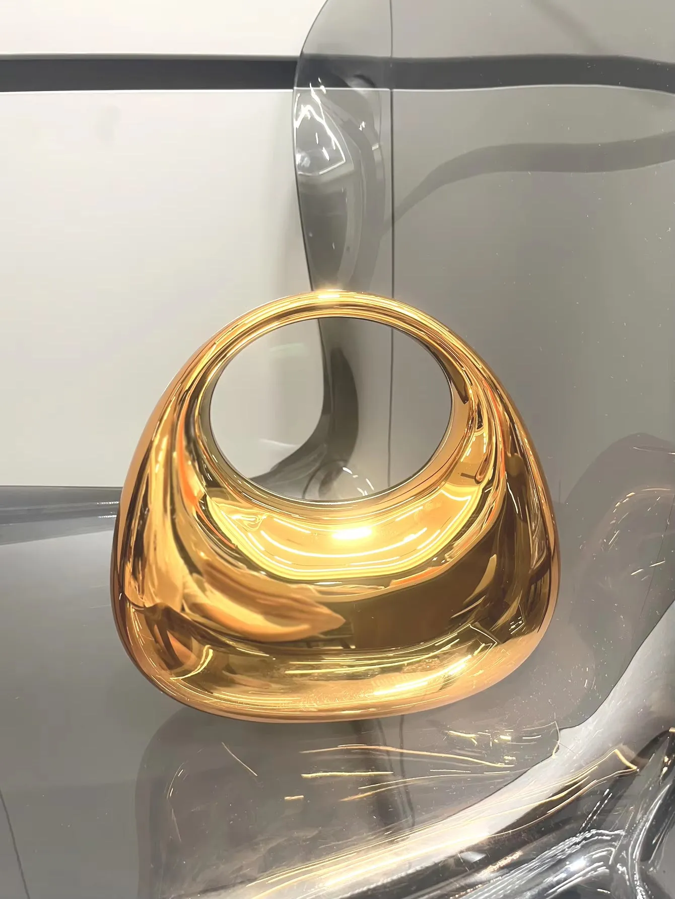 Golden Luxe Moon Clutch – The Epitome of Elegance & Sophistication